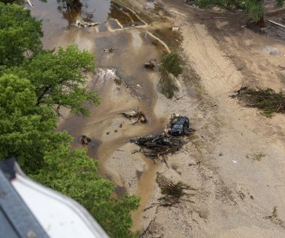 Texas flooding death toll more than 100 as searches continue