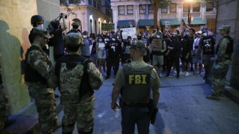 Kneel, and you’re out: FBI fires agents in 2020 protest picture