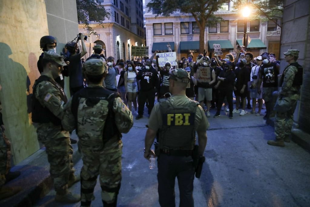 Kneel, and you’re out: FBI fires agents in 2020 protest picture